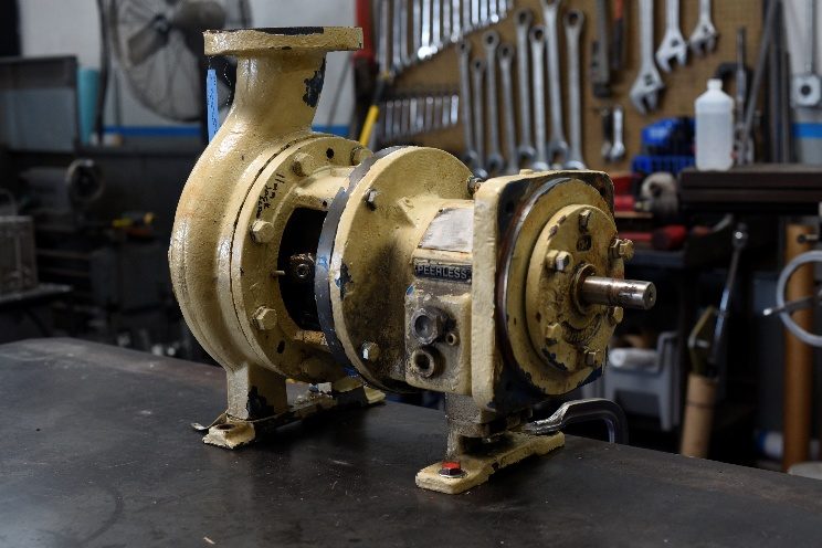 Peerless 8196 pump as received on the shop bench, original yellow paint