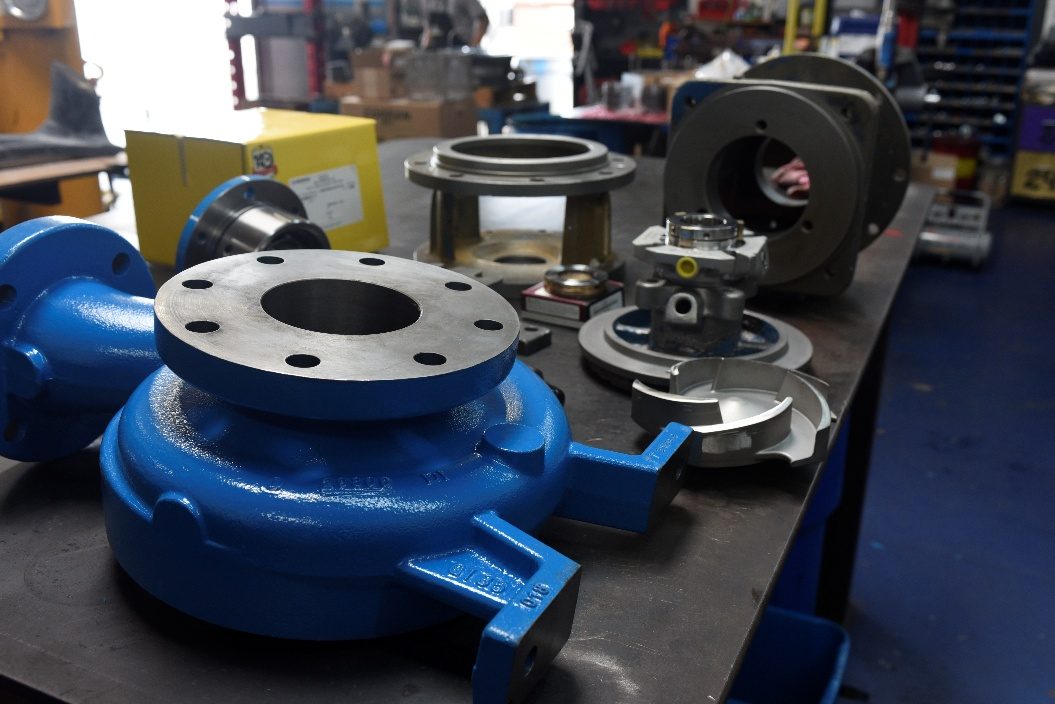 Cleaned and new components staged on the bench ready for assembly
